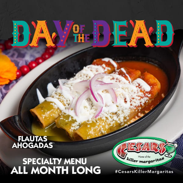 Flautas Ahogadas, a Mexican dish with green and red sauces, cheese, and red onions, on a black plate.